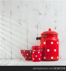 Red polka dot utensils. Red polka dot vintage kitchen utensils on a white talbe