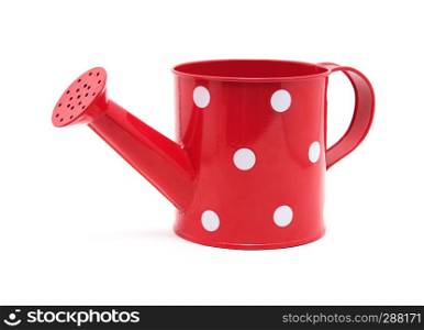red polka dot watering can isolated on white