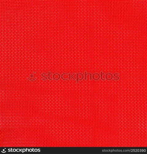 red polyester fabric texture useful as a background. red polyester fabric texture background