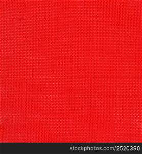red polyester fabric texture useful as a background. red polyester fabric texture background