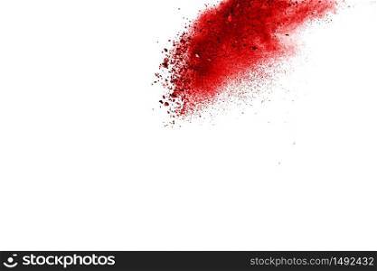 Red powder explosion on white background. Paint Holi.