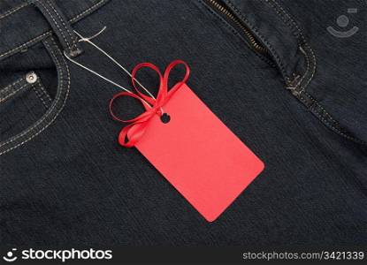 Red price tag over jeans