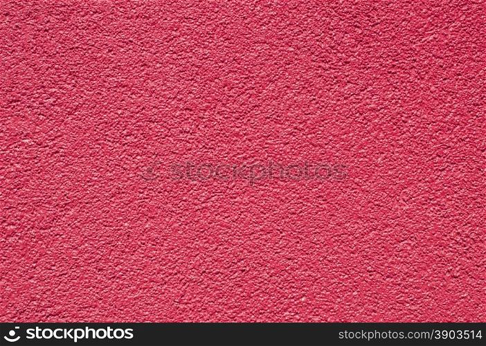 Red purple painted facade house wall closeup as background