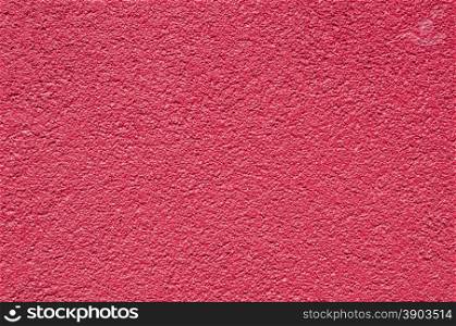 Red purple painted facade house wall closeup as background
