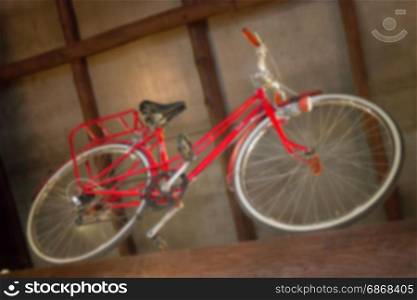 Red retro bicycle showed on the ceiling, stock photo
