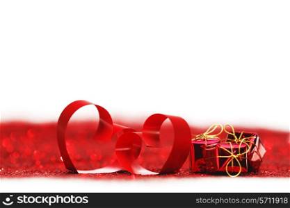 Red ribbon hearts and presents on glitters isolated on white, Valentines day concept