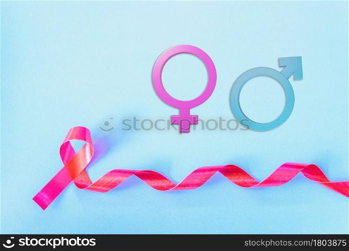 Red Ribbon Support HIV, AIDS and Male and female gender signson blue background and copy space for use, activism and relationship of sex concept
