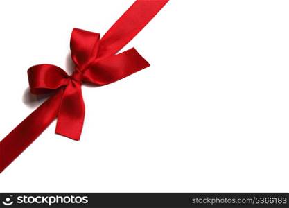 Red ribbon with bow isolated on white background