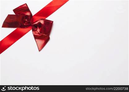 red ribbon with bright bow
