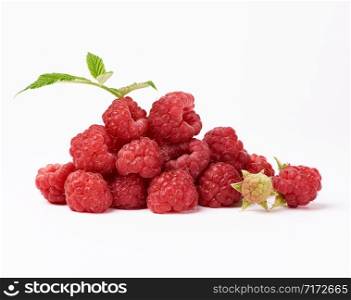 red ripe raspberries and green leaf on a white background, summer sweet crop, close up