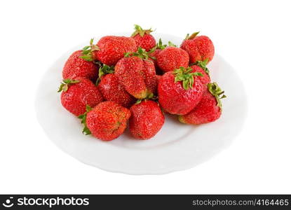 red ripe strawberries at plate isolated on white