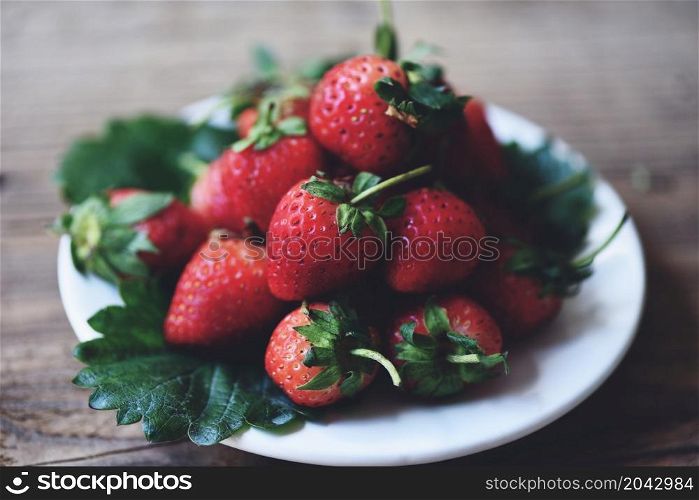 Red ripe strawberry on white plate background, Fresh strawberries on on the wooden table