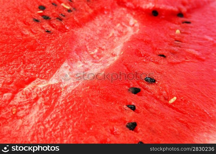 Red ripe watermelon as a background.