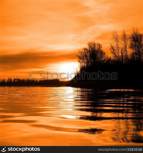 red river landscape with sunset against ripple water