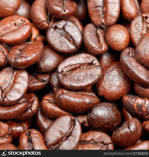 red roasted coffee beans close up background