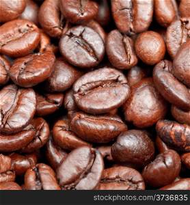 red roasted coffee beans close up background