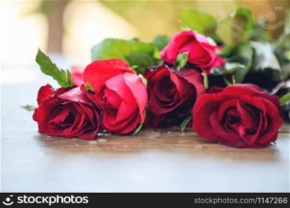 Red rose flower bouquet / Pink and red roses Valentines day love on wooden table nature background for lover concept