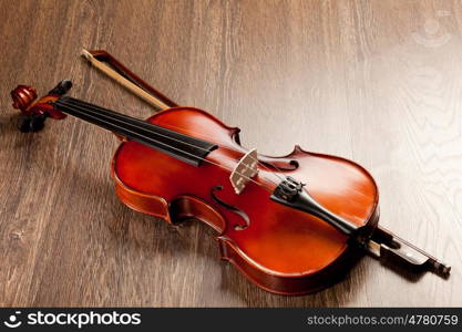 Red roses and a violin. Red roses and a violin on the table