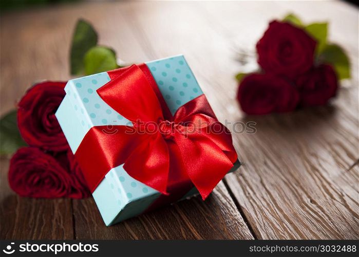 Red roses and gift box, love background . Valentines day heart and gift box