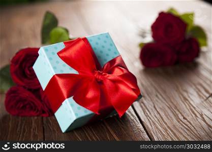 Red roses and gift box, love background . Valentines day heart and gift box