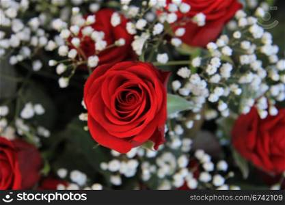 Red roses and white gypsophila or baby&rsquo;s breath in a valentine&rsquo;s bouquet