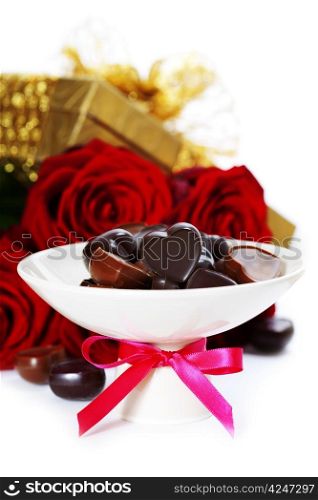 red roses, gifts and chocolate hearts for Valentine&rsquo;s Day