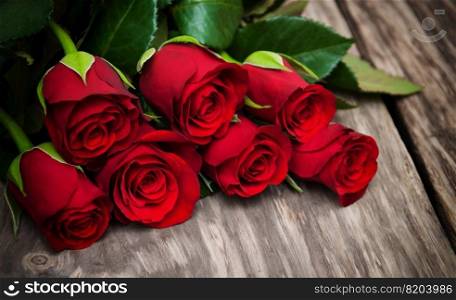 Red roses  on a old wooden table