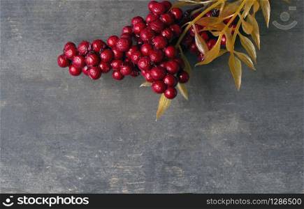 Red rowan berries on vintage rustic wooden background/ Autumn background with red berries and copyspase/ christmas background with red berries space for text nature. Red rowan berries on vintage rustic wooden background/ Autumn background with red berries and copyspase/ christmas background with red berries space for text