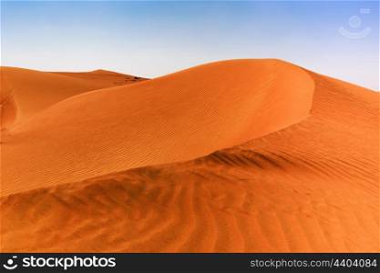 red sand dunes in the Arabian desert