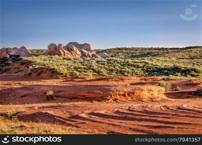 red sandstone formation and prairie in Sand Creek National Monument at Colorado and Wyoming border near Laramie