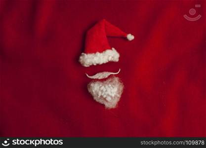 Red Santa Claus hat on red background minimalism