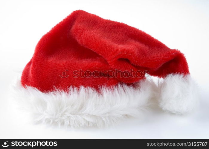 Red Santa Hat Against White Studio Background