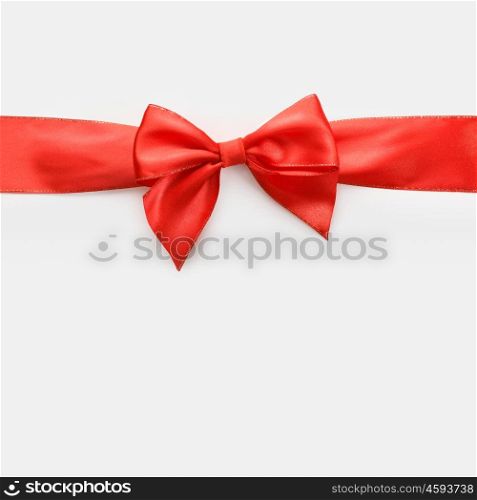 red satin bow on white background