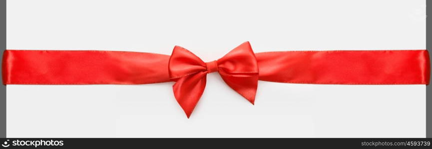red satin bow on white background