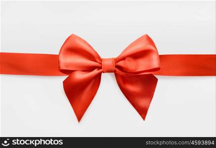 red satin bow on white background, whole object is cut with clipping path