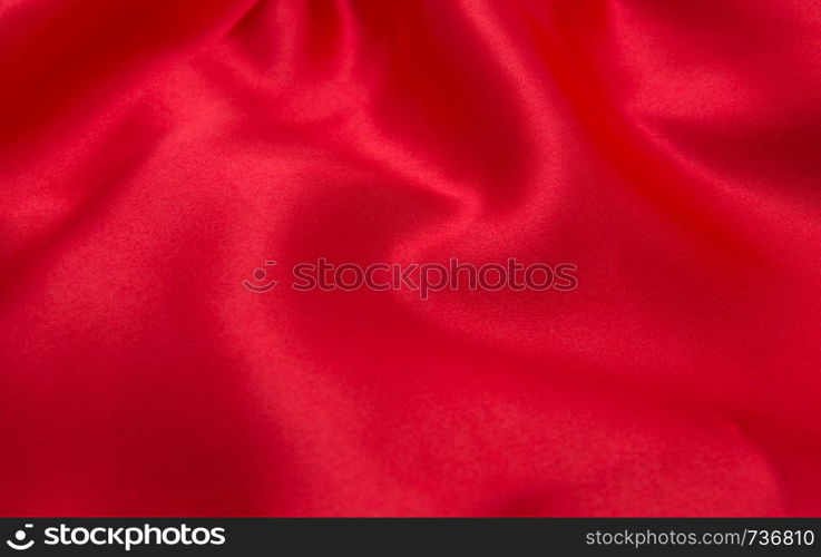 red satin or silk fabric as background