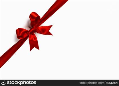 Red satin ribbon bow isolated on white background. Red bow isolated on white