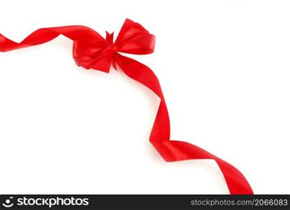 Red satin ribbon with bow isolated over white background
