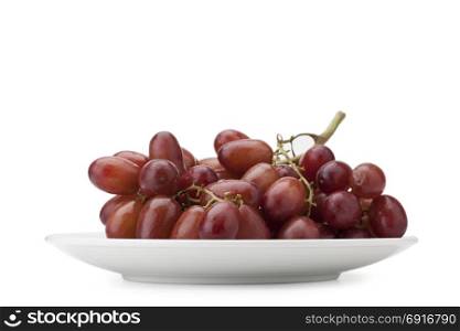 red seedless table grapes isolated on white background with clipping path