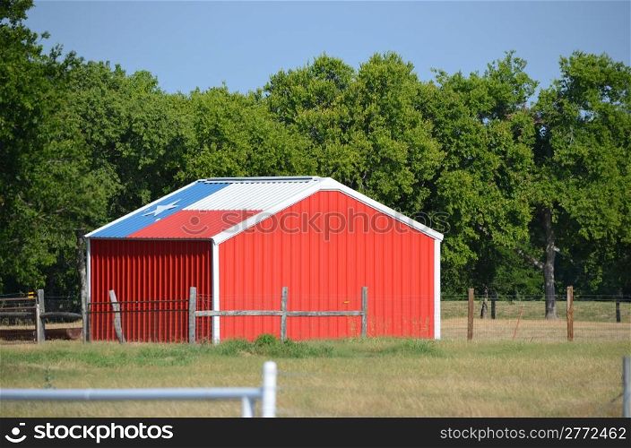 Red shed with Texas flag on the roof