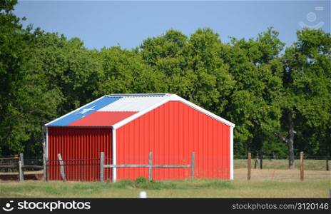Red shed with Texas flag on the roof