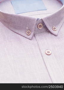 red shirt with focus on collar and button, close-up. cotton shirt, close-up