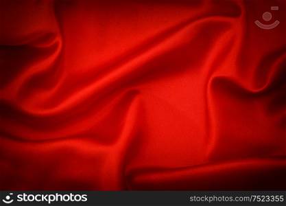 Red silk background. Dark tonet with vignette