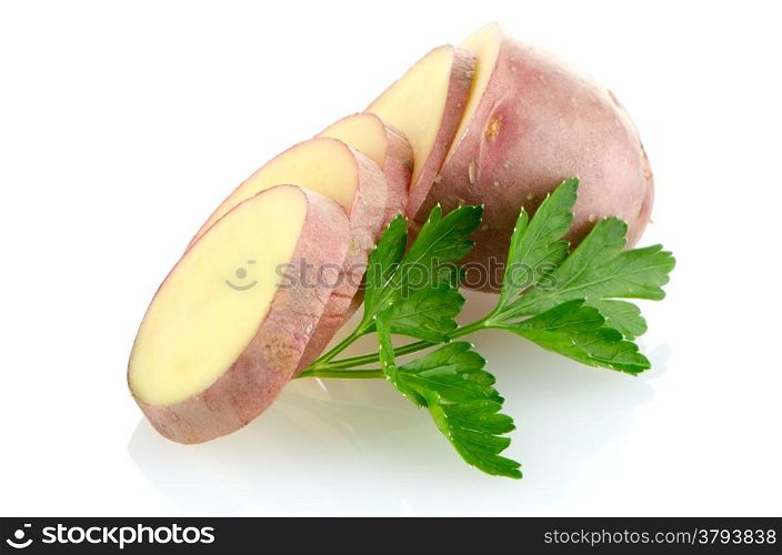 Red sliced potatoes on white reflective background.