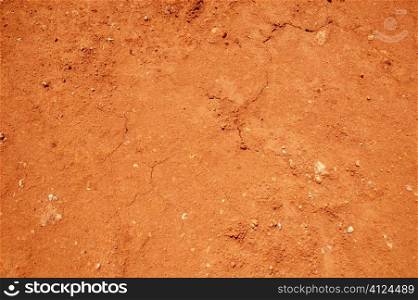 Red soil texture background, dried clay surface