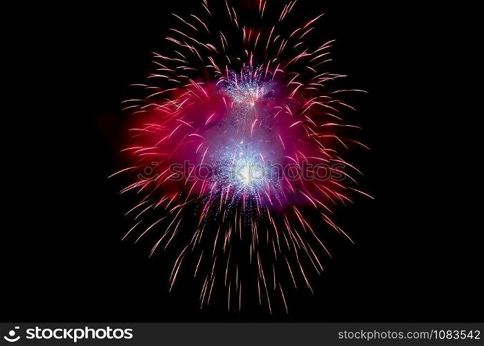 Red Sparkling Fireworks Background on Night Scene. Abstract color fireworks background and smoke on sky