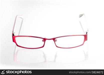 Red spectacles on isolated white background
