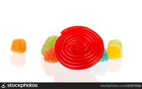 Red spiral of licorice and jelly beans isolated on a white background