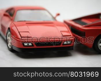 Red sports toy car of Italian brand
