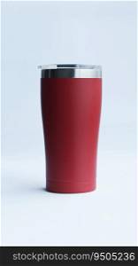 Red stainless steel tumbler and mug vacuum insulated double wall travel cup with lid isolated on white.